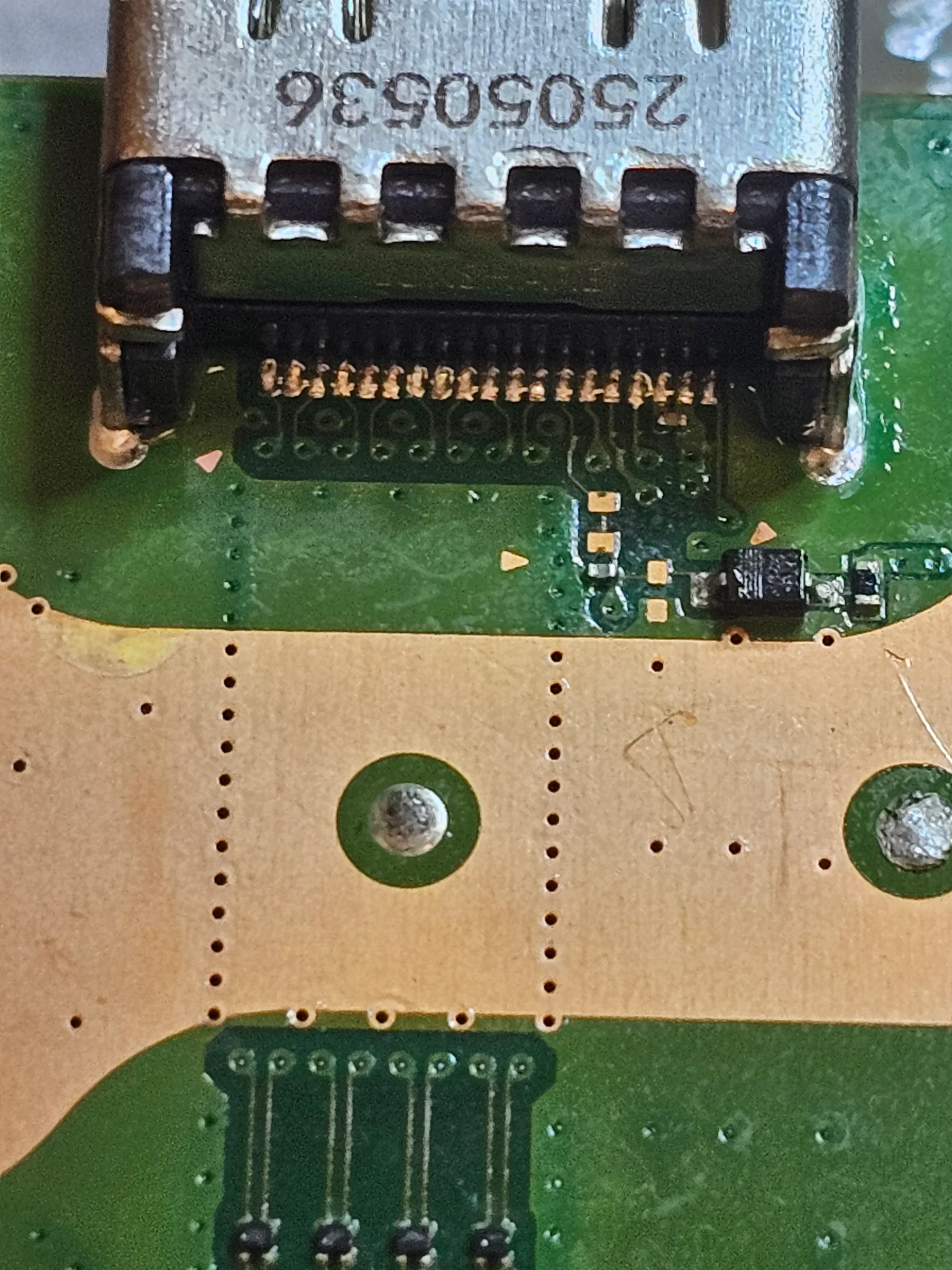 Completed HDMI port repair on a console motherboard
