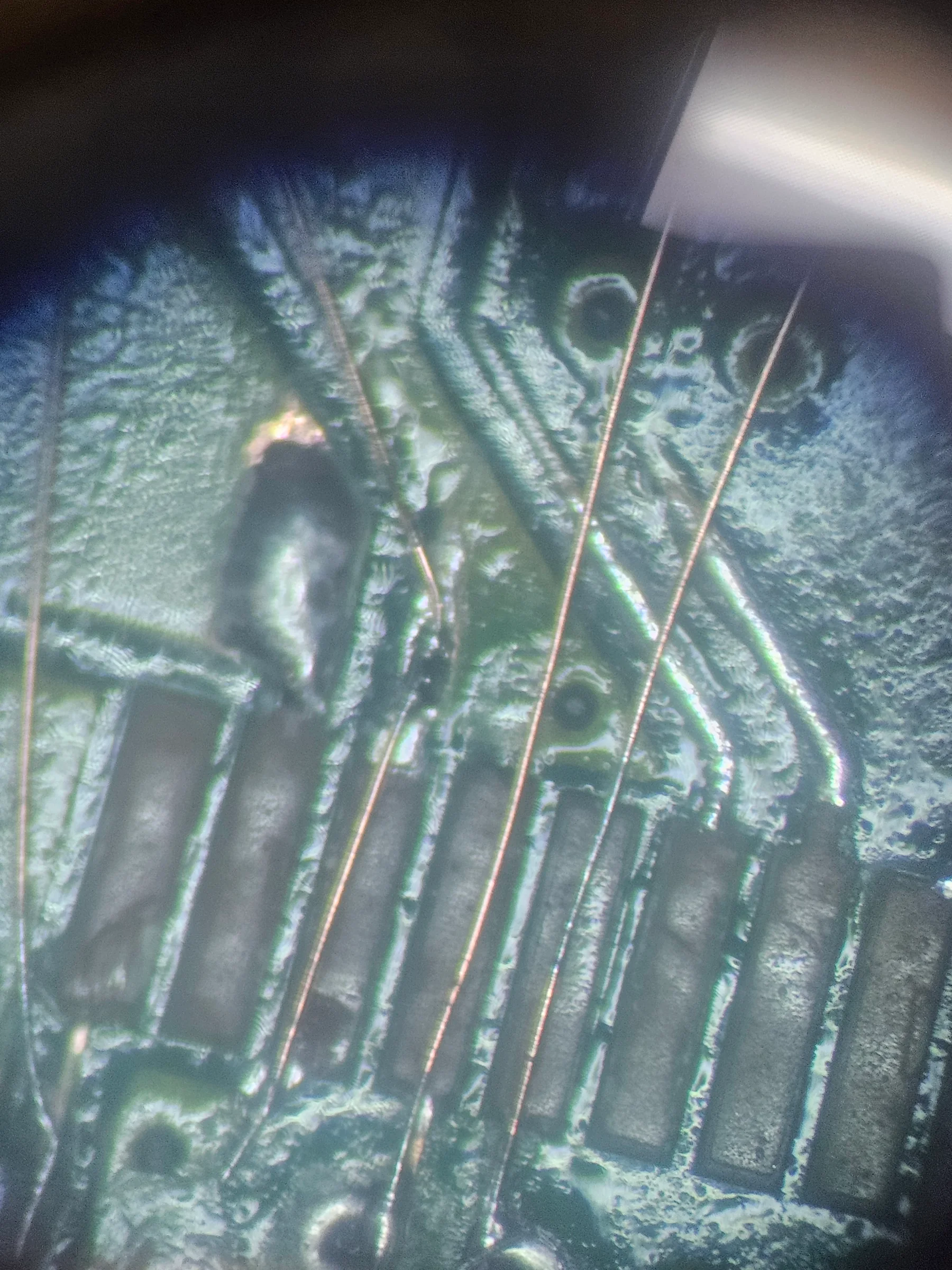 HDMI board trace repair under a microscope