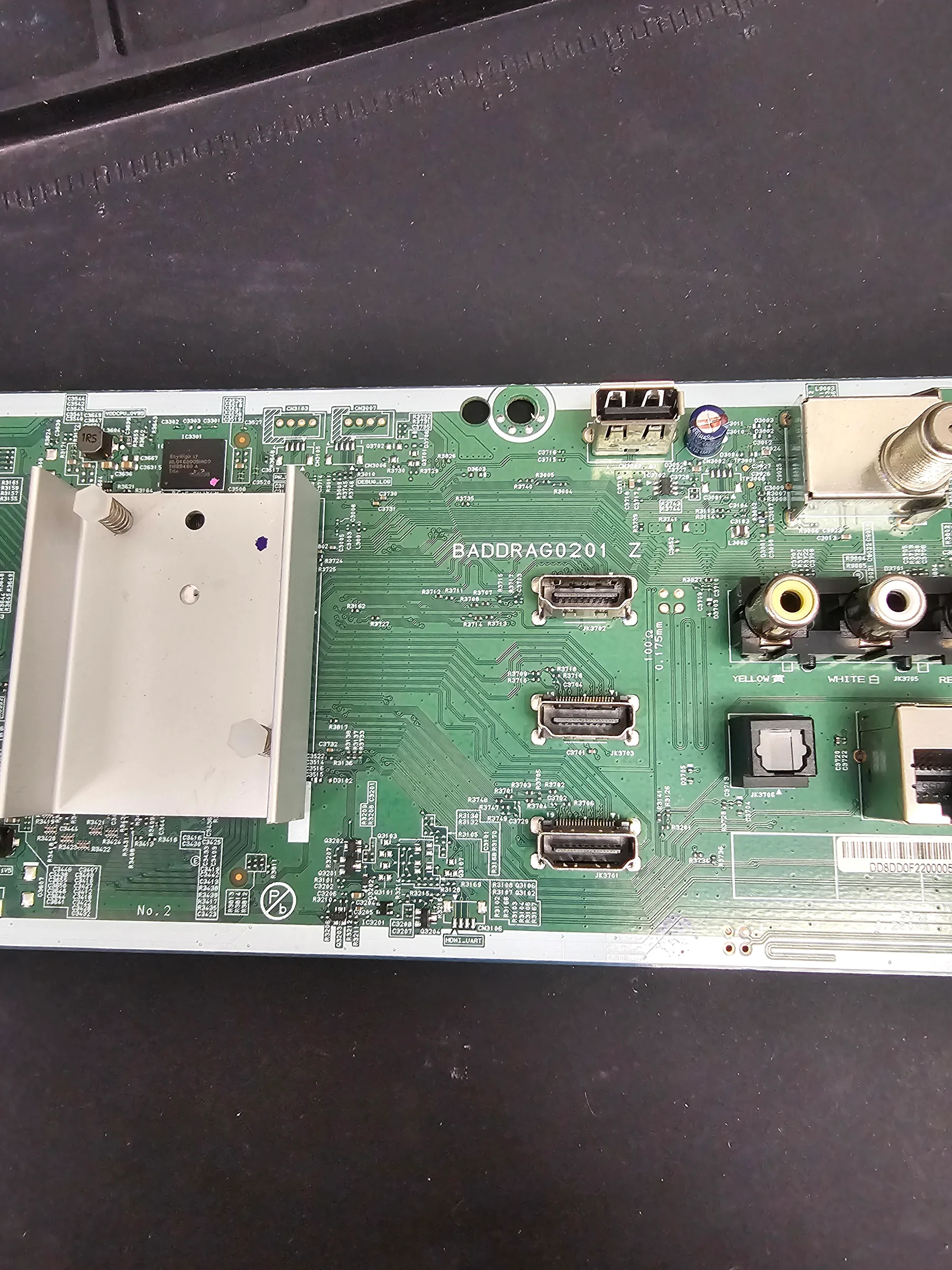 Completed HDMI repair on a television mainboard